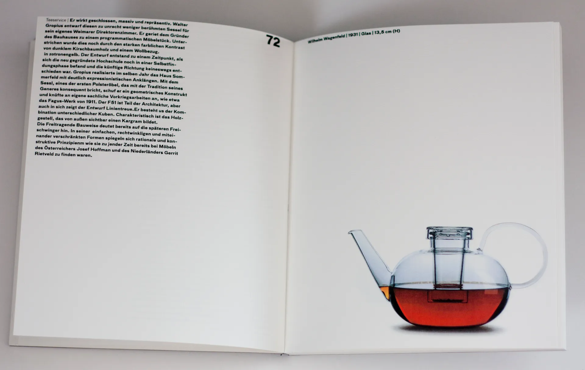 Open Bauhaus book showing a teapot product image and editorial text